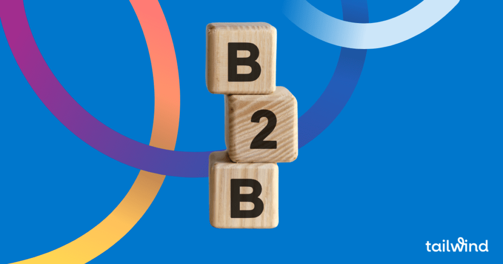 Image of wooden toy blocks stacked on each other with B 2 B stamped on them on a blue background with the tailwind logo in white font.